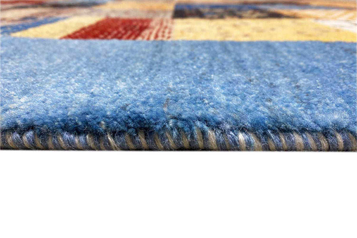 Rug edge with short pile and a visible fringe border in light blue