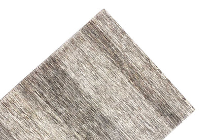 Gabbeh rug, corner in close-up, mottled gray-beige with a clean edge