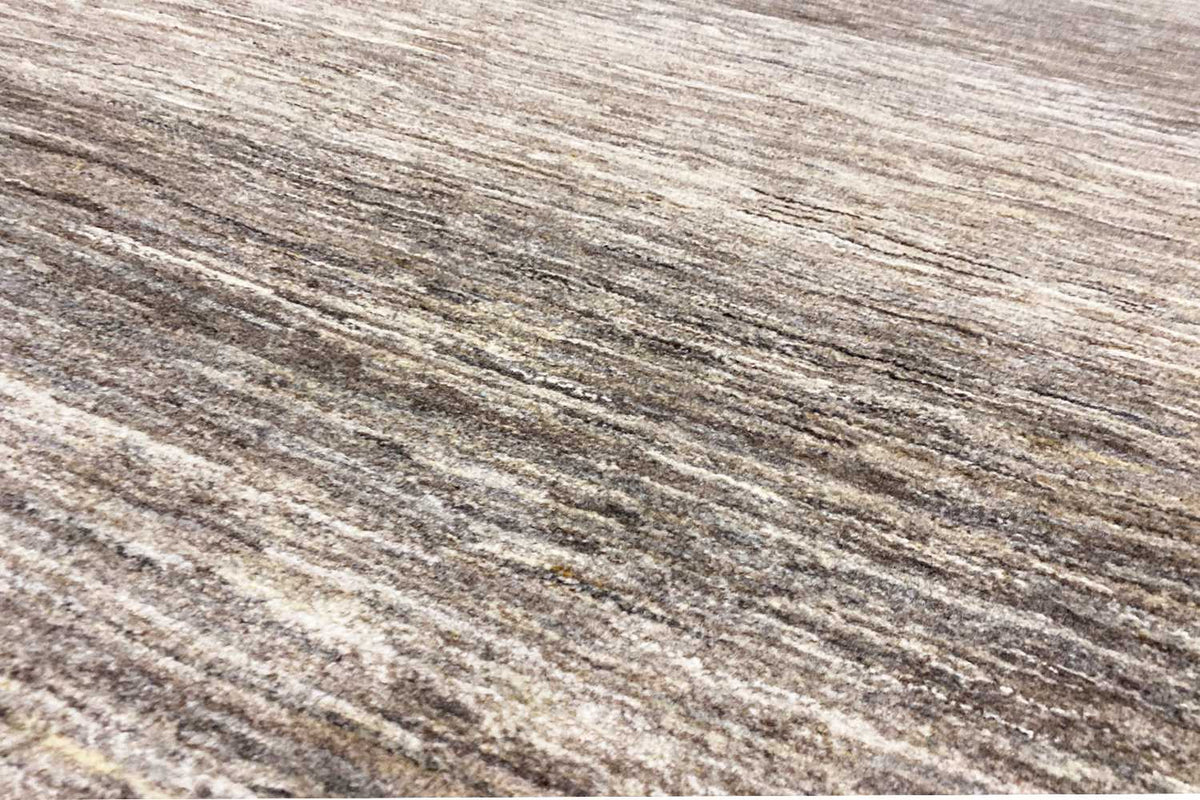 Gabbeh rug, surface detail, beige and gray mottled with a fine elongated texture