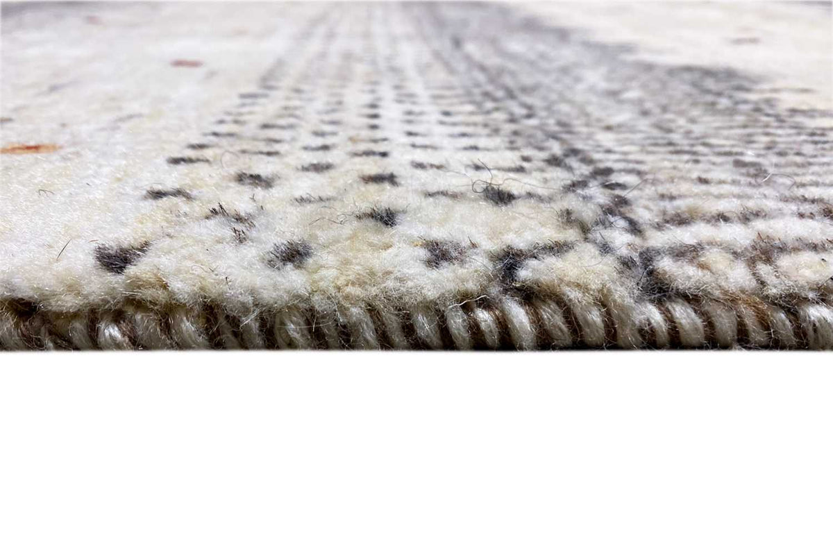 Gabbeh rug: detailed pile and fiber structure with short, dense fringes