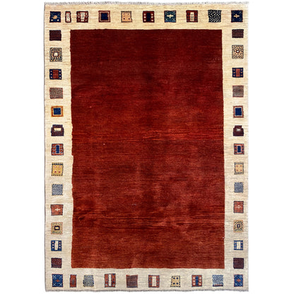 Gabbeh rug with a red rectangular pattern and a beige border with small ornaments