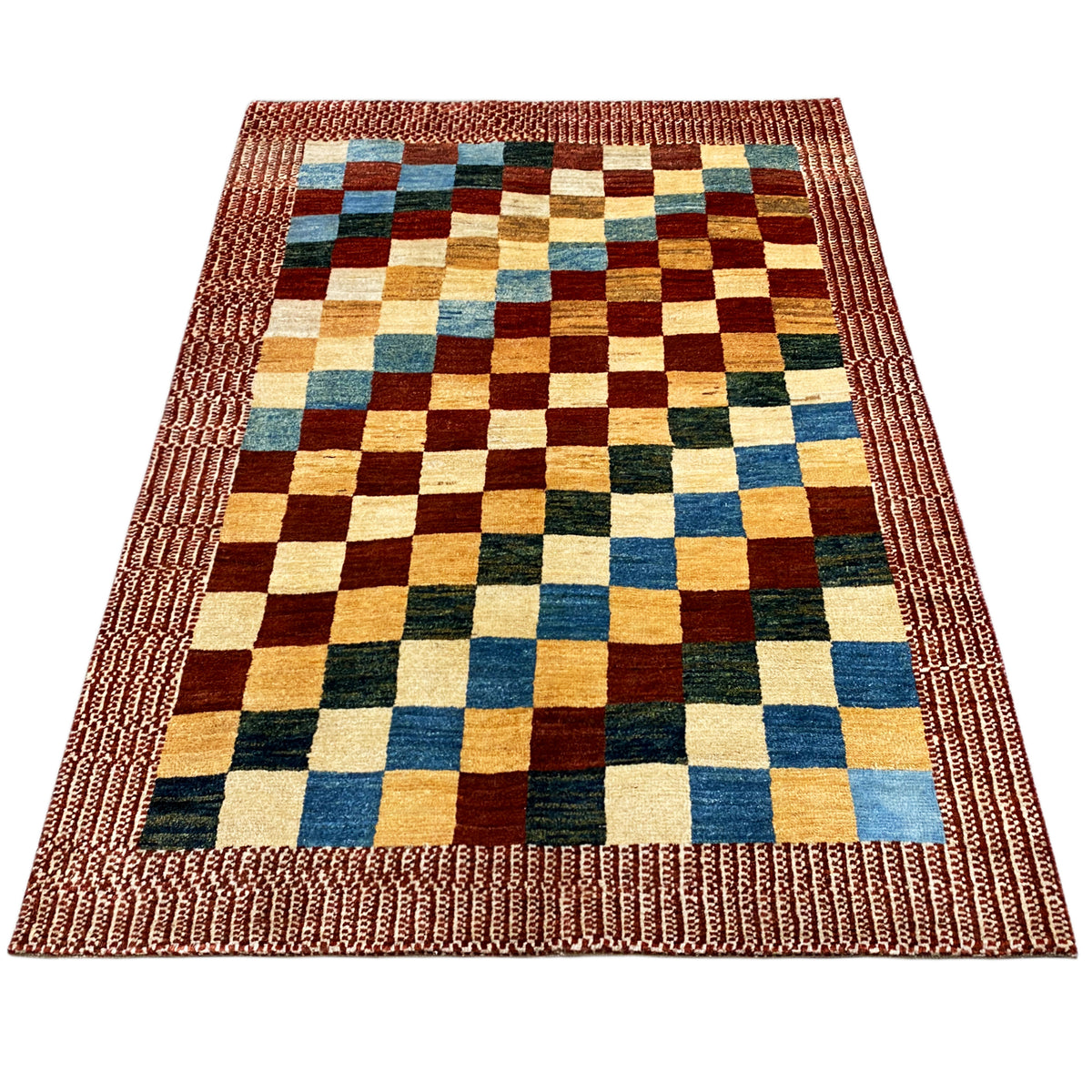 Gabbeh rug laid flat with a wide decorative stitched border and multicolored square check pattern