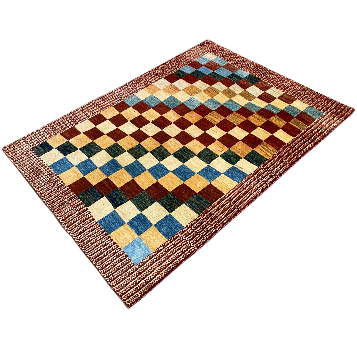 Gabbeh rug with a checkered pattern in blue, green, beige, and brown, with a reddish-brown border