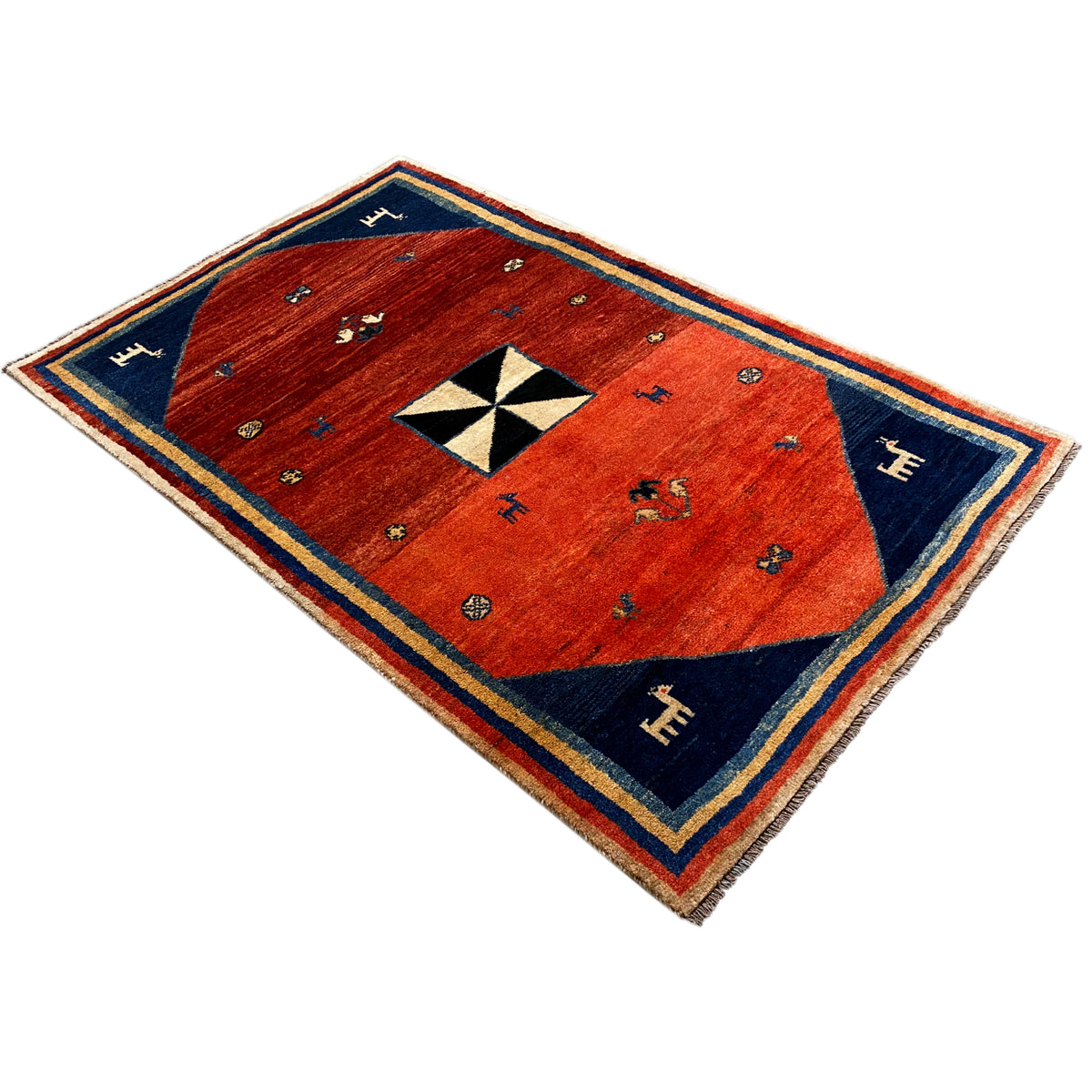 Gabbeh rug, reddish brown with a blue border, white-and-black star medallion