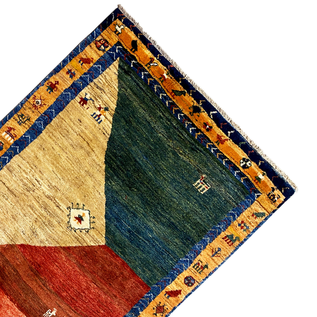 Gabbeh rug corner with a blue border, beige and green areas, small ornaments