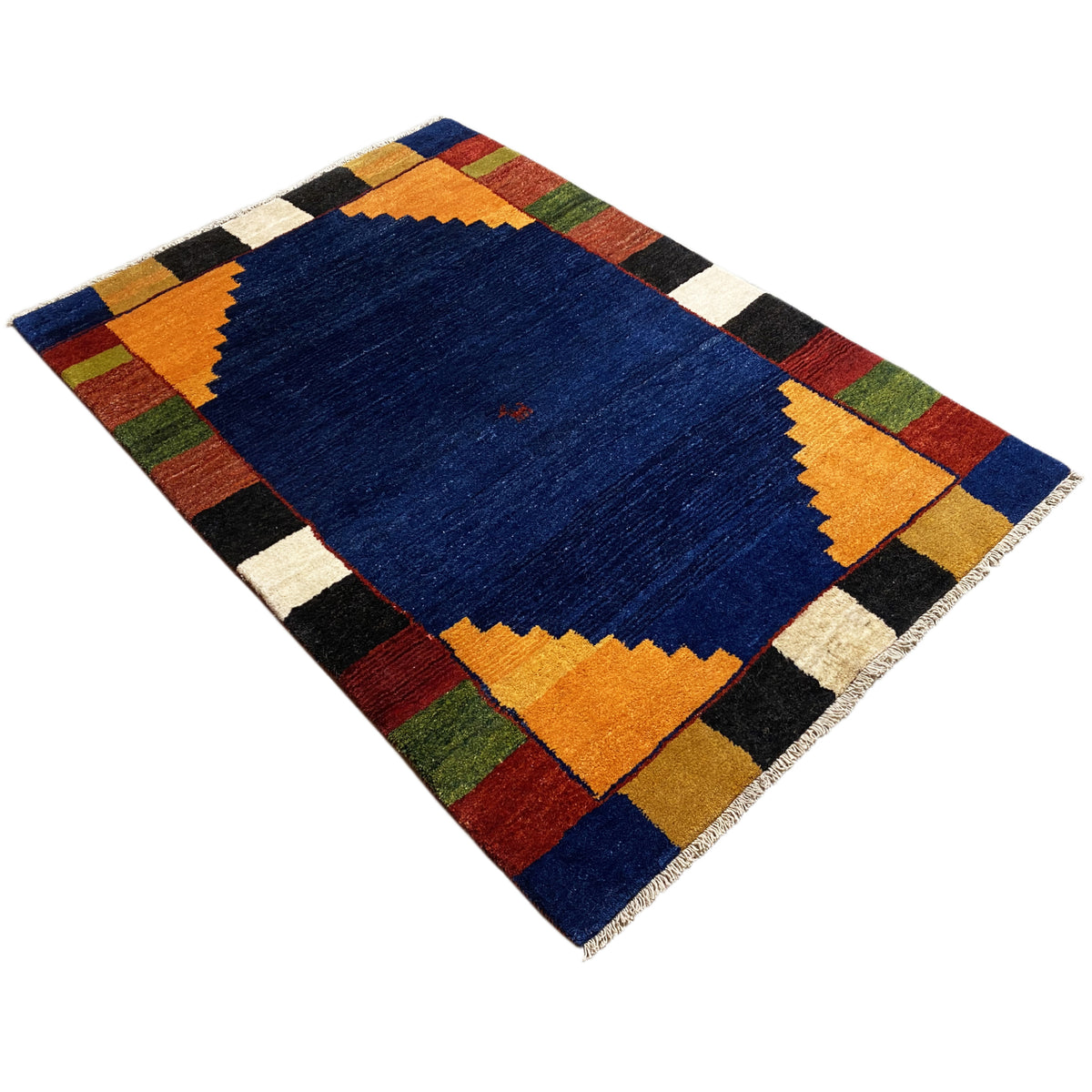 Rug with a blue center, yellow-orange zigzag borders, and colorful checkered elements.