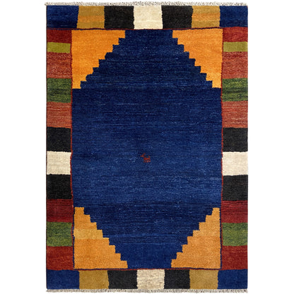 Rectangular rug with a blue medallion and multicolored checkered border.