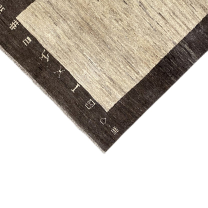 Rug corner with a beige central field and dark outer border, fine pile, fringes
