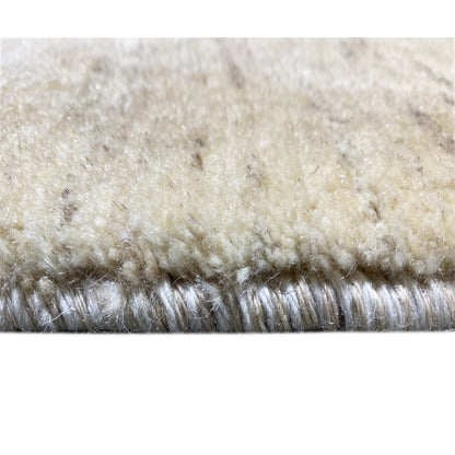 Gabbeh rug detail: dense pile in light beige