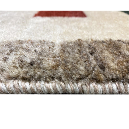 Gabbeh rug close-up of the pile: short, mottled fibers in beige and brown tones