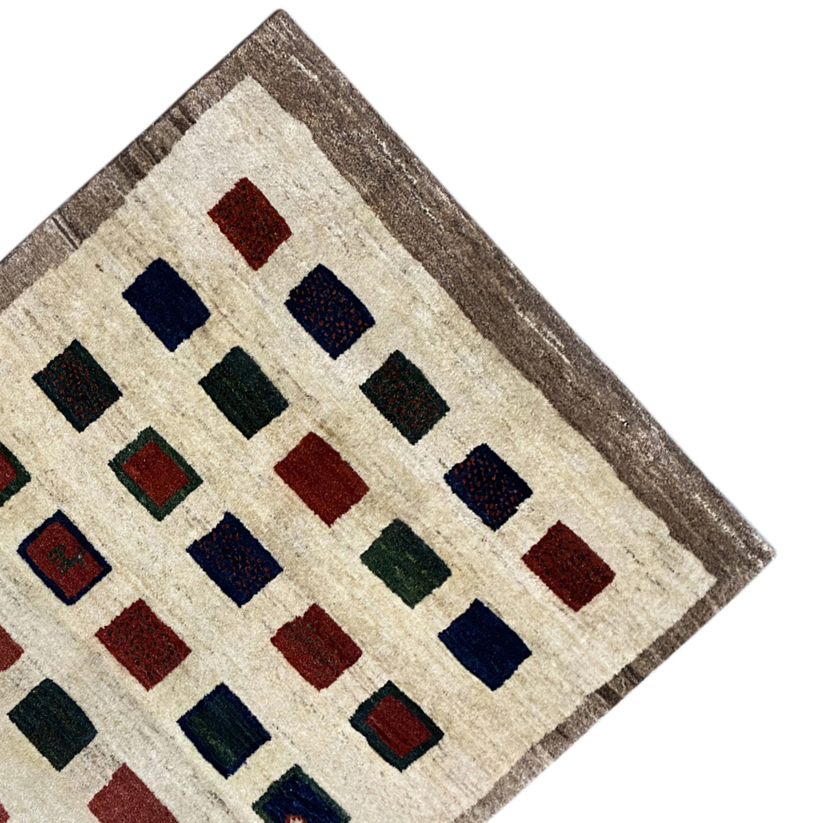 Gabbeh rug corner with a framed border in gray and colorful squares on beige