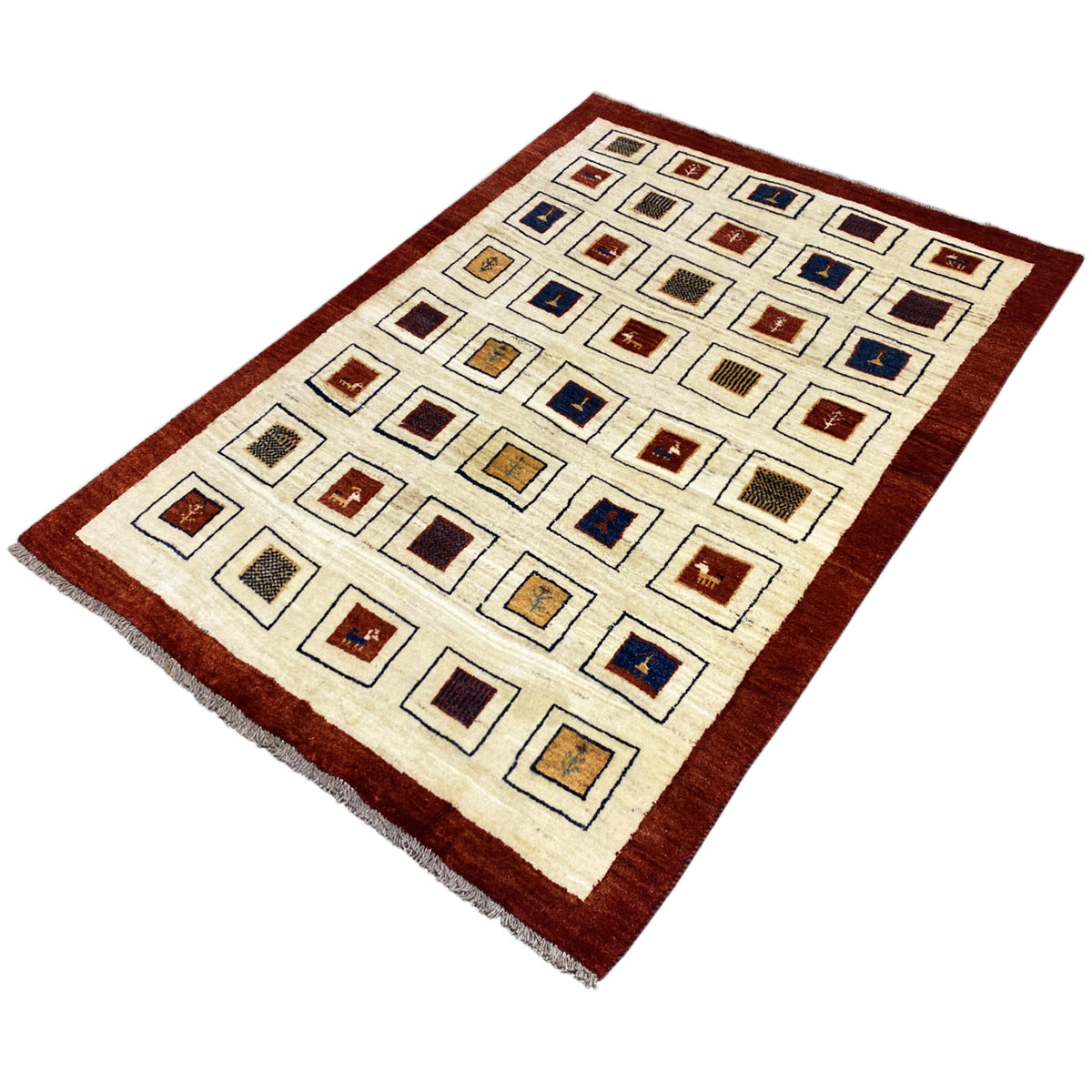 Gabbeh rug with geometric squares, cream-colored center and reddish-brown border, slightly angled
