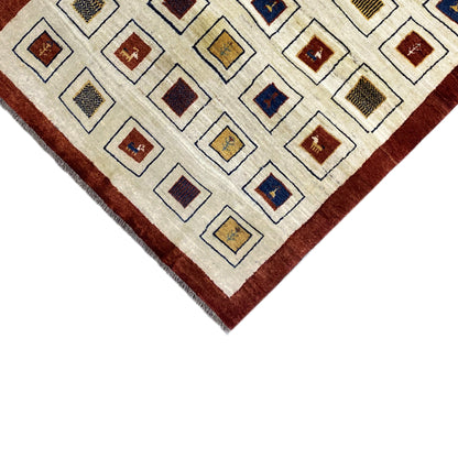 Rug corner with a cream-colored pattern and reddish-brown border, fine fringes along the edge