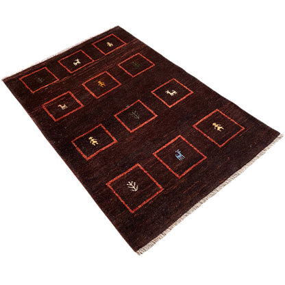 Brown Gabbeh rug with red rectangles and woven animal/symbol motifs, 147x99 cm