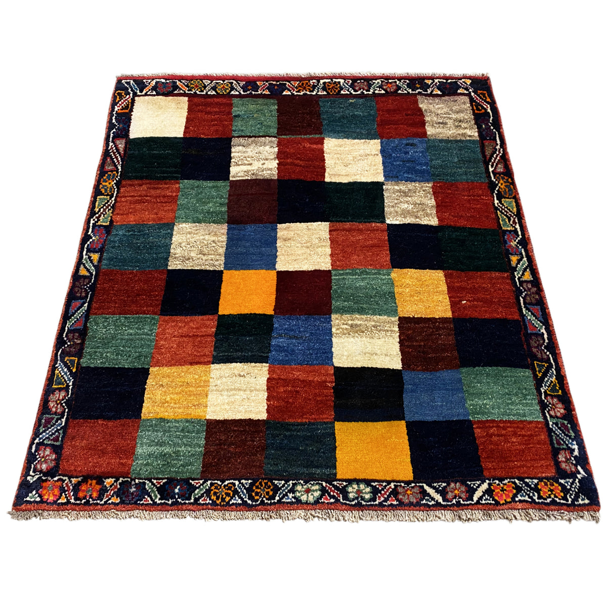 Gabbeh rug 127x114 cm, displayed at an angle, colorful checkered pattern with a bordered edge