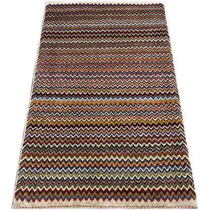 Gabbeh rug 130x75 cm, wide multicolored zigzag pattern with a bound edge.