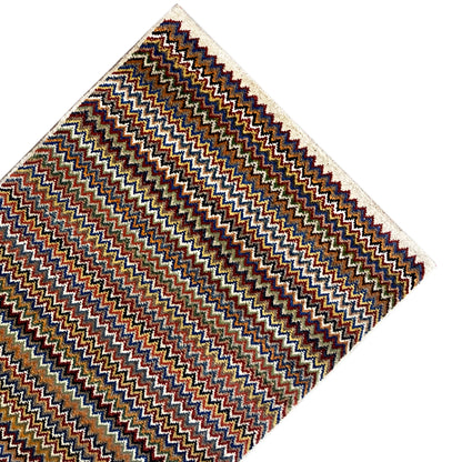 Gabbeh rug 130x75 cm, laid diagonally: zigzag stripes in brown, blue and orange/red.