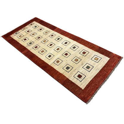 Flat-weave runner rug: cream-colored patterned field with a brown border