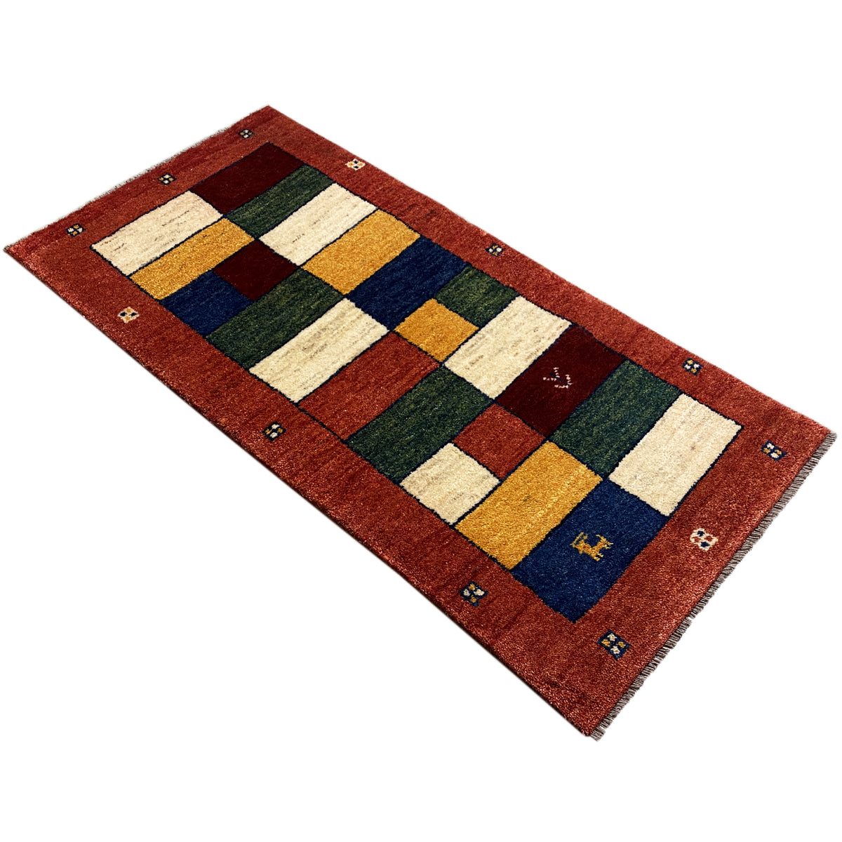 Gabbeh runner with a square appearance and geometric patchwork in red, cream, blue, and green