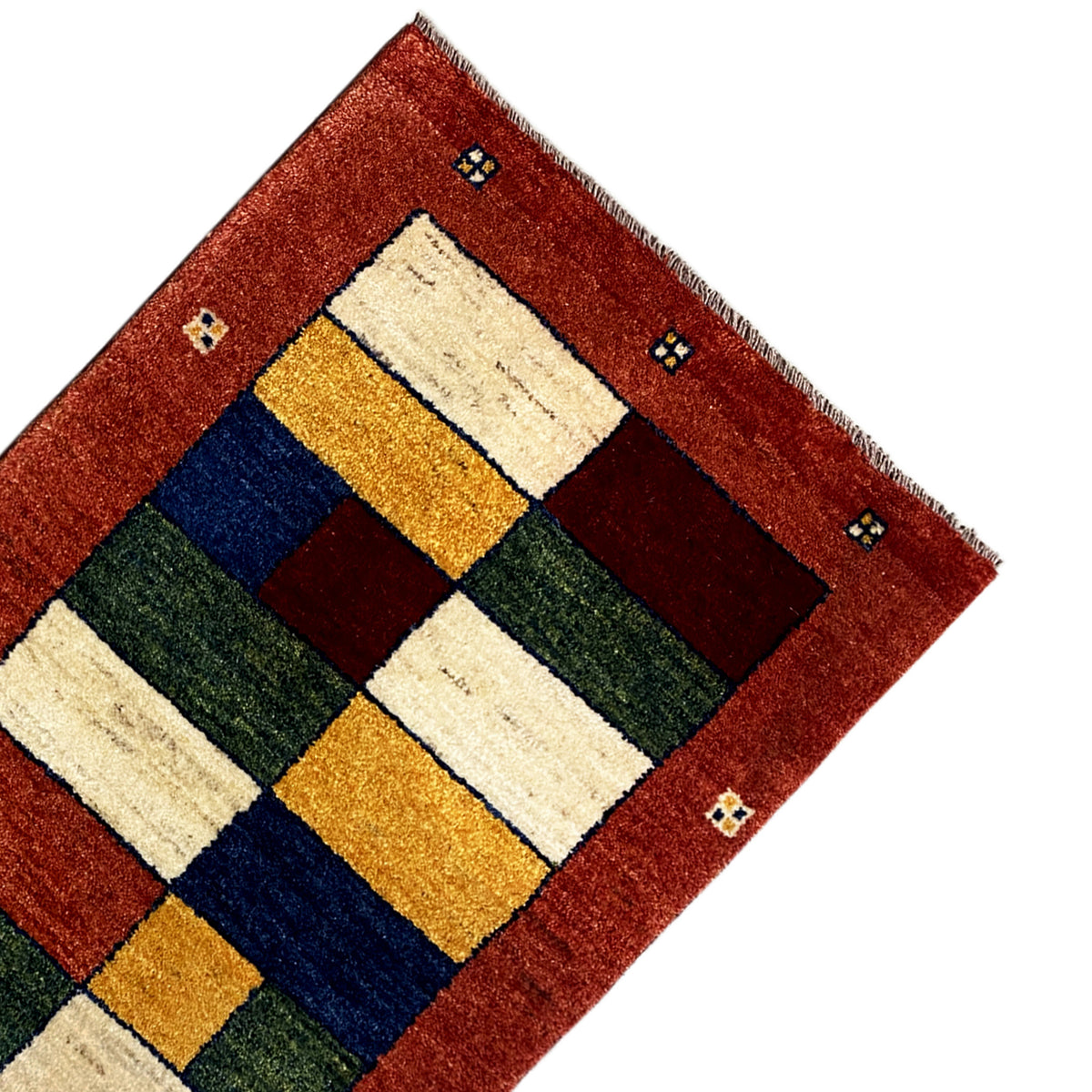 Gabbeh runner detail view: geometric blocks in red, cream, blue, green, and gold