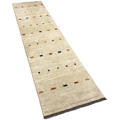 Gabbeh runner, beige with rows of small squares and dot patterns, side hem visible