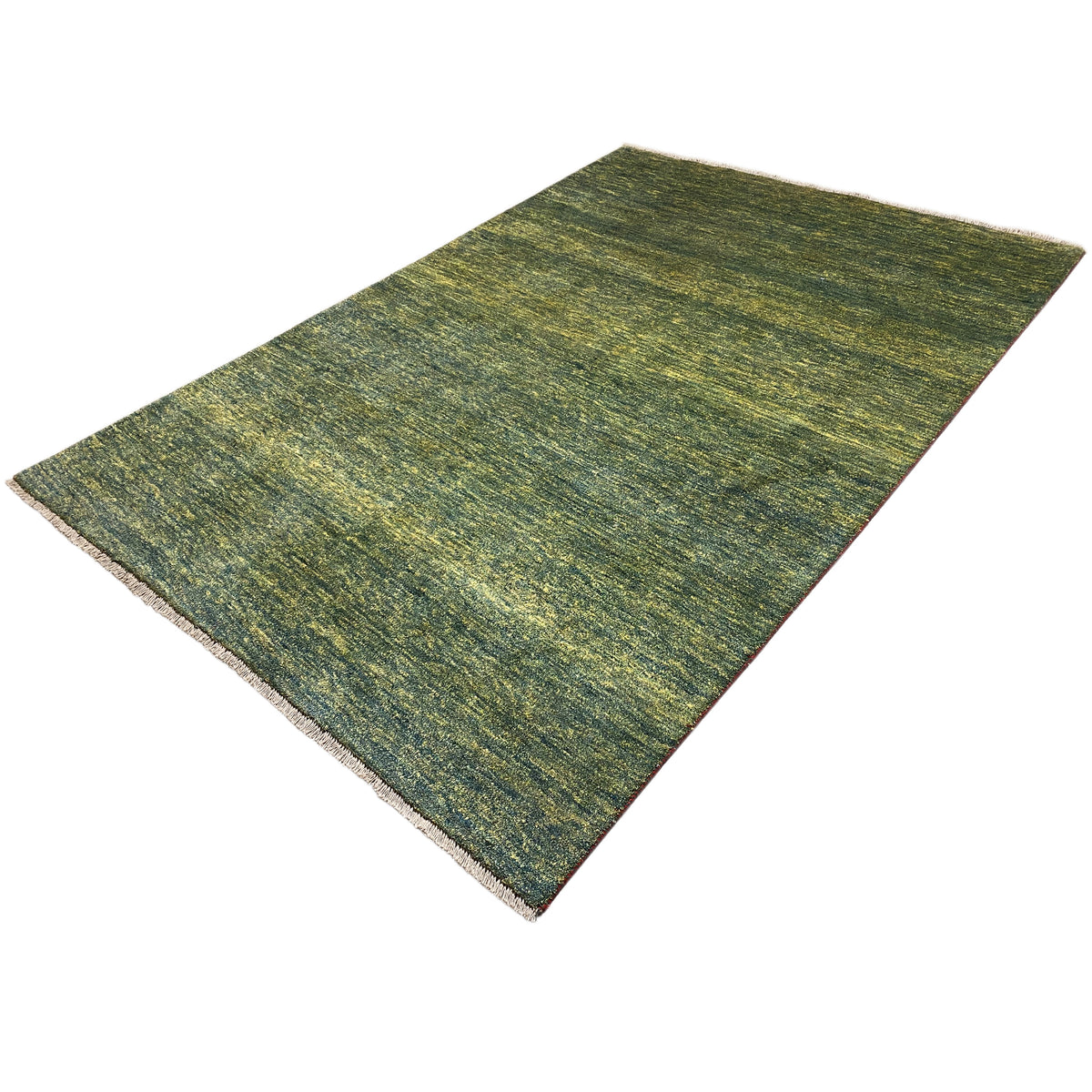 Green patterned Gabbeh rug, narrow fringes along the edge