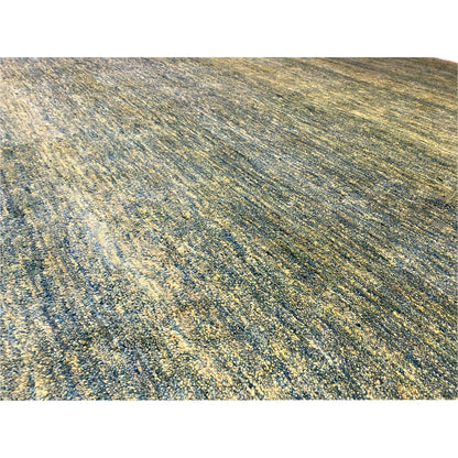 Close-up of Gabbeh rug: green-yellow mélange, fine woven fiber texture