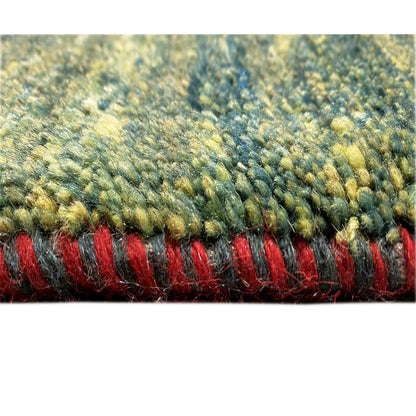 Gabbeh rug detail of the selvedge: green pile fibers with red weft threads