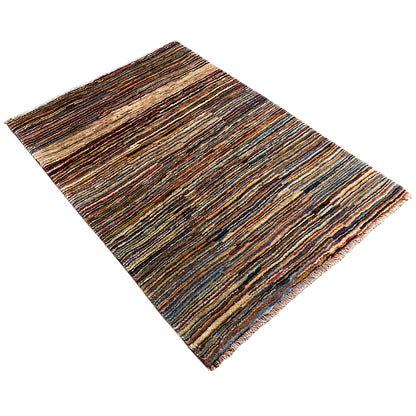 Gabbeh rug, diagonal view: multicolored stripes with fringes