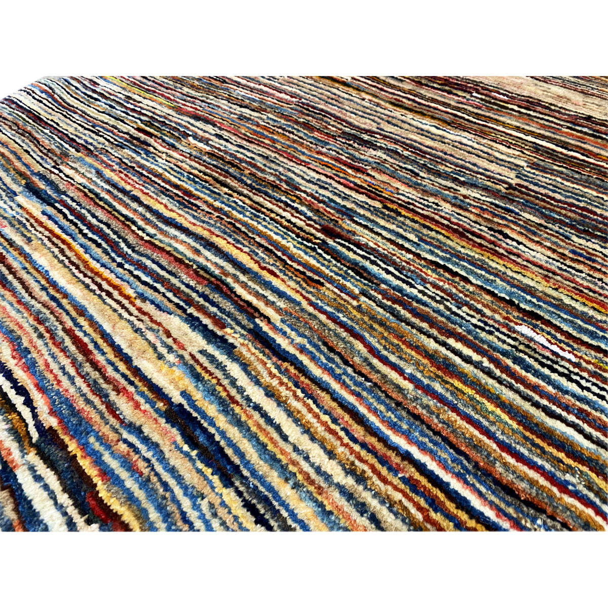Close-up: Gabbeh rug with densely woven multicolored stripes