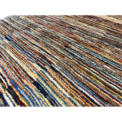 Close-up: Gabbeh rug with densely woven multicolored stripes