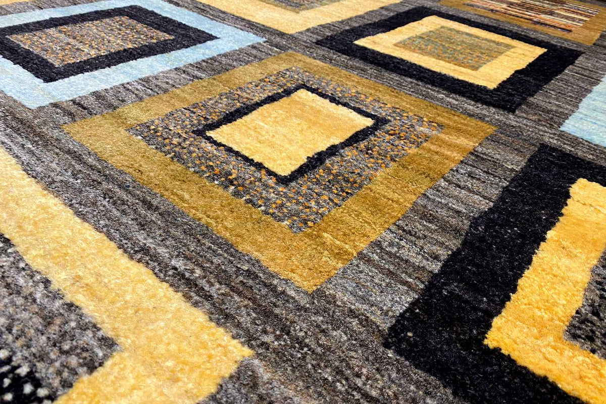 Close-up of a Gabbeh rug: yellow and black diamonds in the woven pile