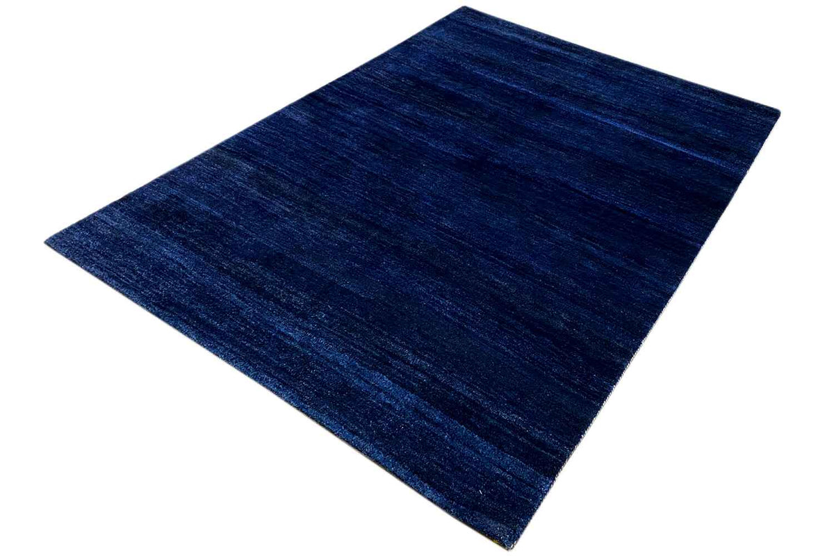 Blue Gabbeh rug, diagonal perspective with subtle color gradients