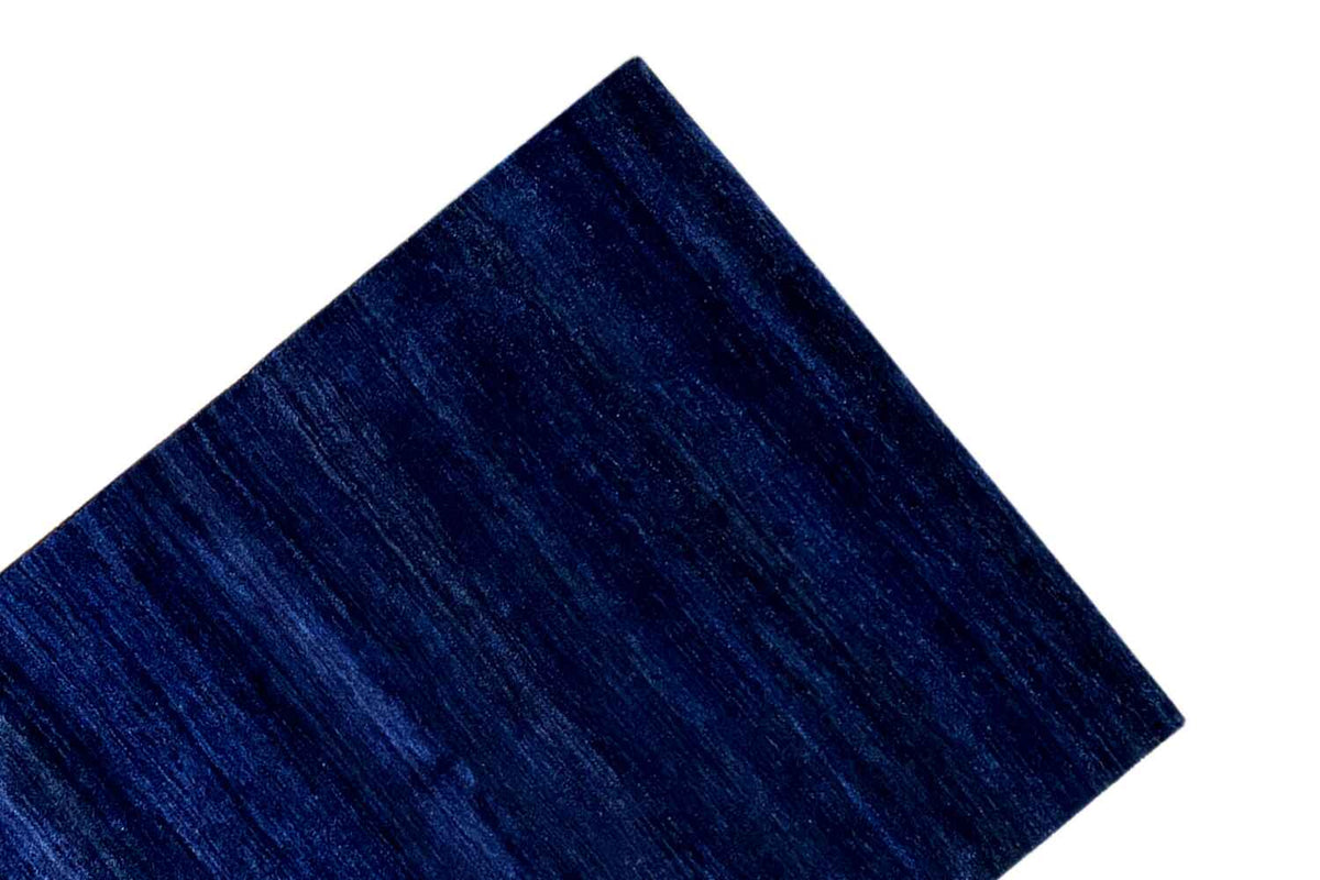 Blue Gabbeh rug: detail of the surface with elongated, fine textures