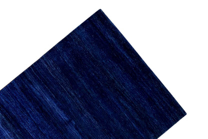 Blue Gabbeh rug: detail of the surface with elongated, fine textures
