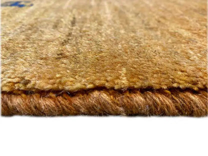 Gabbeh rug 154x96 cm, detail of the brown pile texture and bound edge