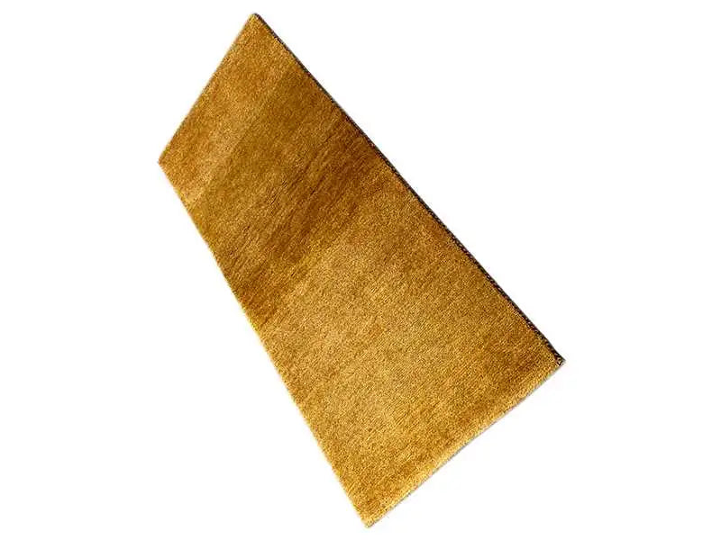 Gabbeh rug 131x62 cm, mustard-gold woven texture, laid out diagonally