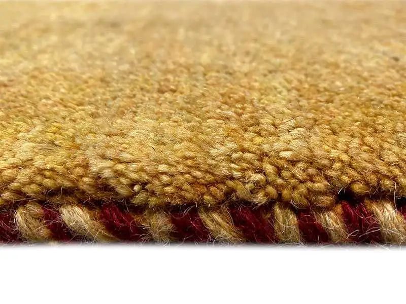 Gabbeh rug 131x62 cm, close-up of the pile: golden fibers with a red border