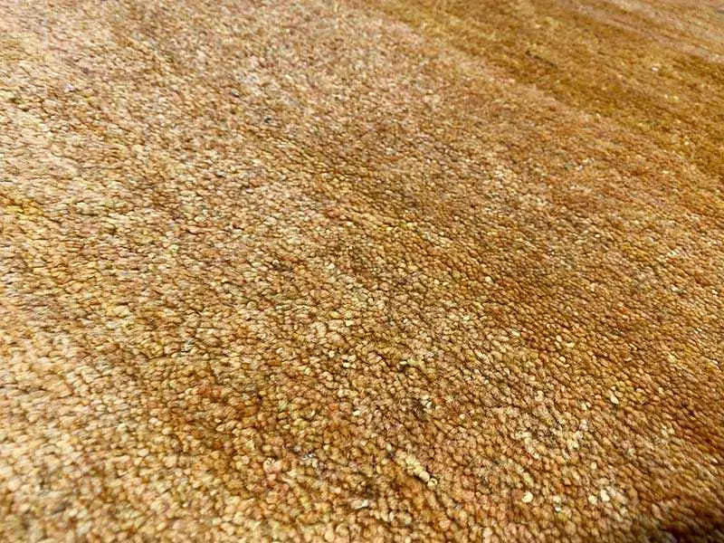 Gabbeh rug 131x62 cm, close-up of golden woven texture and pile height