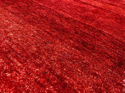 Carpet surface: mottled burgundy red, fine texture, dense pile