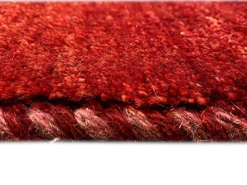 Red Gabbeh rug, detail of the pile and rug edge