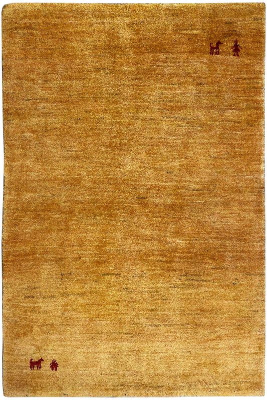 Mustard-yellow rectangular Gabbeh rug with red animal/symbol motifs in the corners