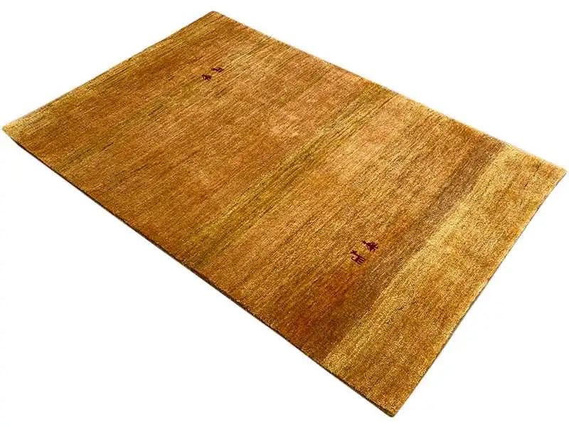 Gabbeh rug (151x100 cm), ochre brown, laid diagonally, small red-black accent motifs