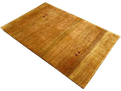 Gabbeh rug (151x100 cm), ochre brown, laid diagonally, small red-black accent motifs