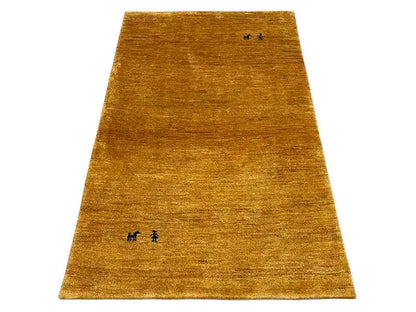 Ochre gabbeh rug with subtle black symbols, rectangular, low-pile