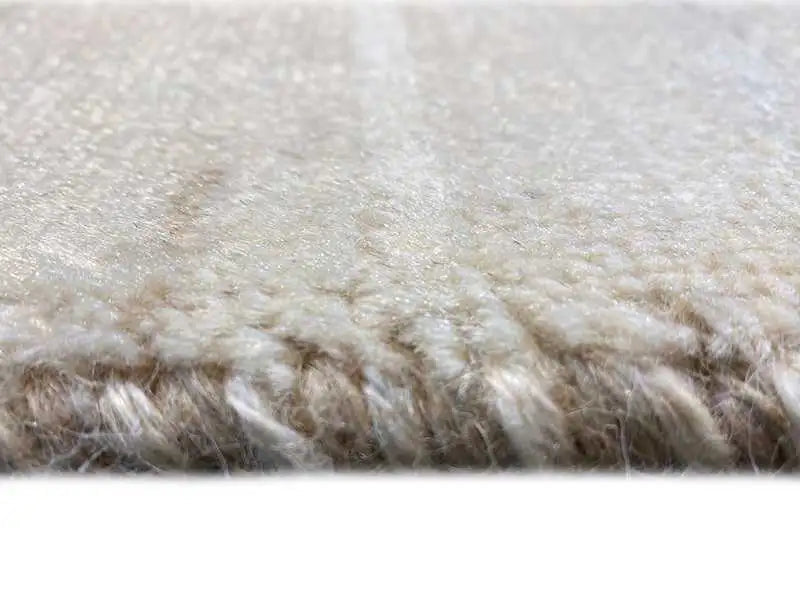 Gabbeh rug: close-up of the pile surface, light beige with dark nuances