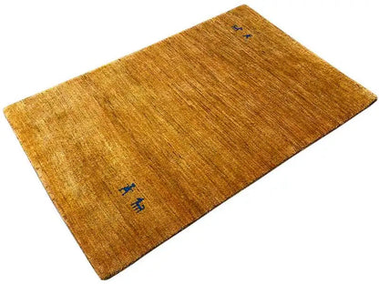 Golden-brown Gabbeh rug with blue decorative pattern