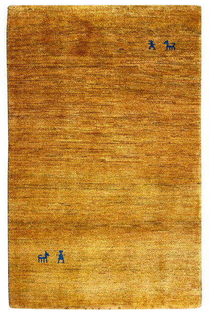 Rectangular gabbeh rug, golden brown with small blue motifs
