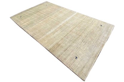 Beige-toned rug with fine, straight lines; blue symbol in the corner