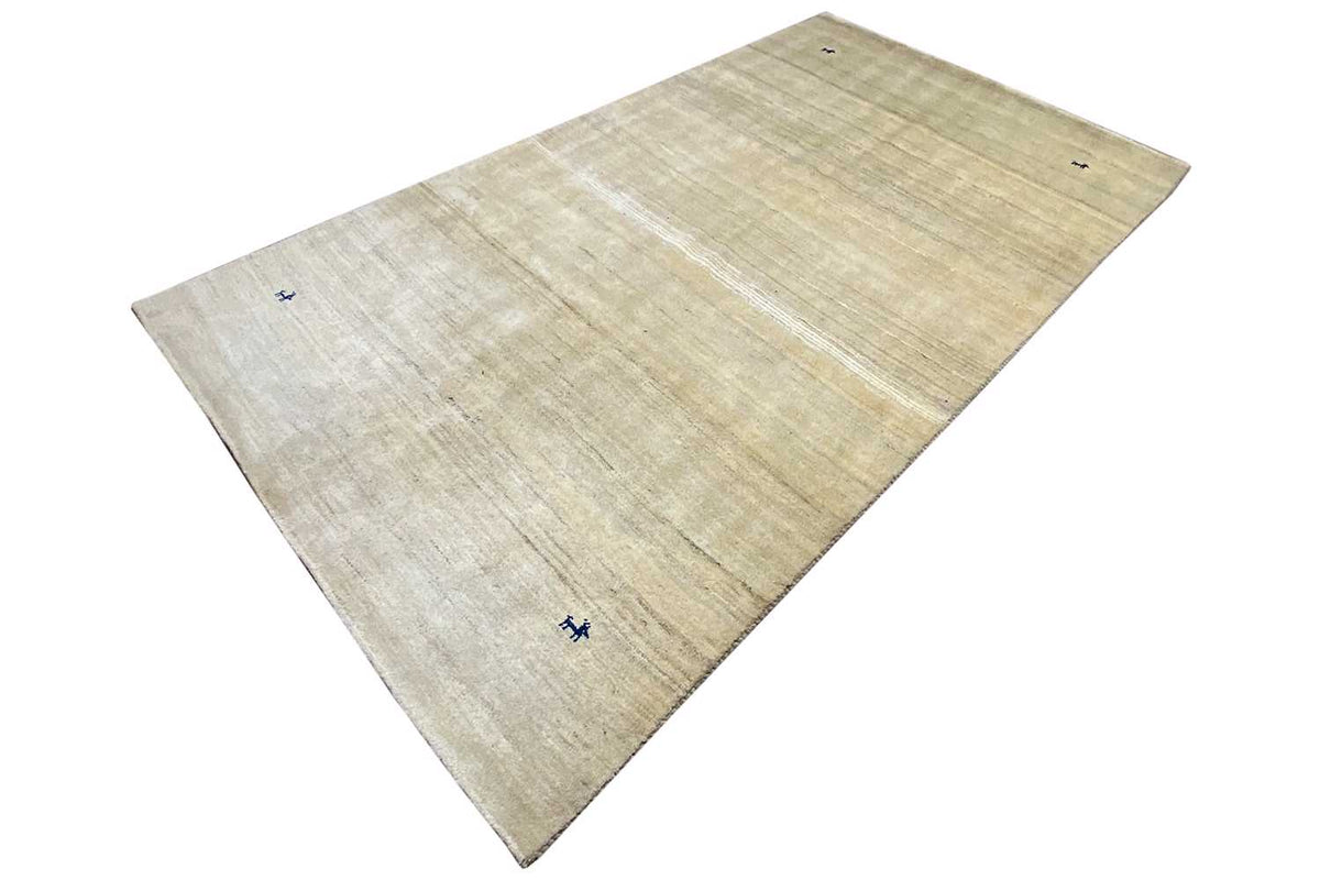 Light beige rug with narrow stripes; small blue symbol in the center
